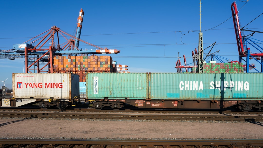 Shipping containers on a train at a port.