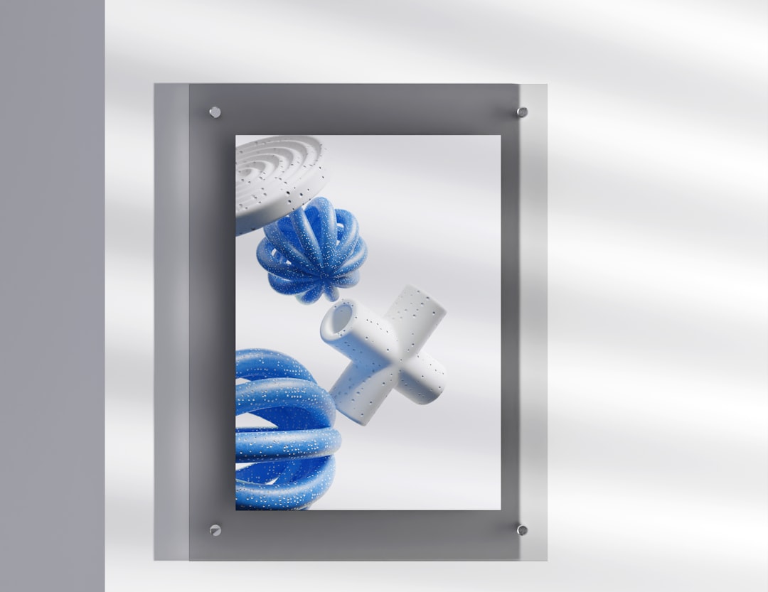 a picture of a blue and white object hanging on a wall